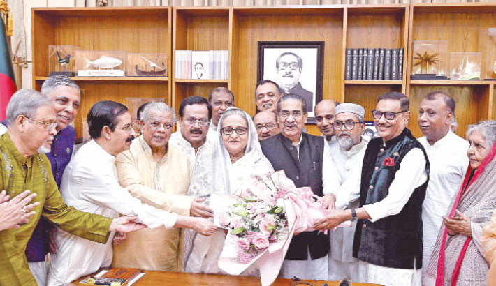 Awami League (AL) leaders greet Prime Minister and AL President Sheikh Hasina with a flower bouquet at her official residence Ganobhaban on the occasion of Eid-ul-Azha on Monday.